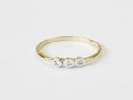 yellow_gold_three_stone_diamond_bezel_setting_ring_jewels_by_tarry
