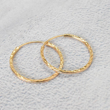 yellow_gold_diamond_hoop_earrings_jewels_by_tarry
