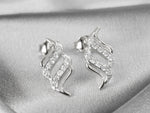 white_gold_diamond_twirl_stud_earring_jewels_by_tarry