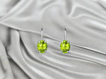 white_gold_gemstone_peridot_oval_shaped_dangle_earrings_jewels_by_tarry