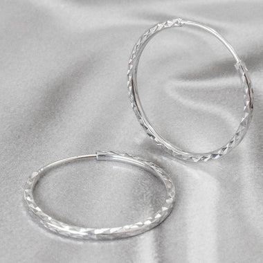 white_gold_diamond_hoop_earrings_jewels_by_tarry